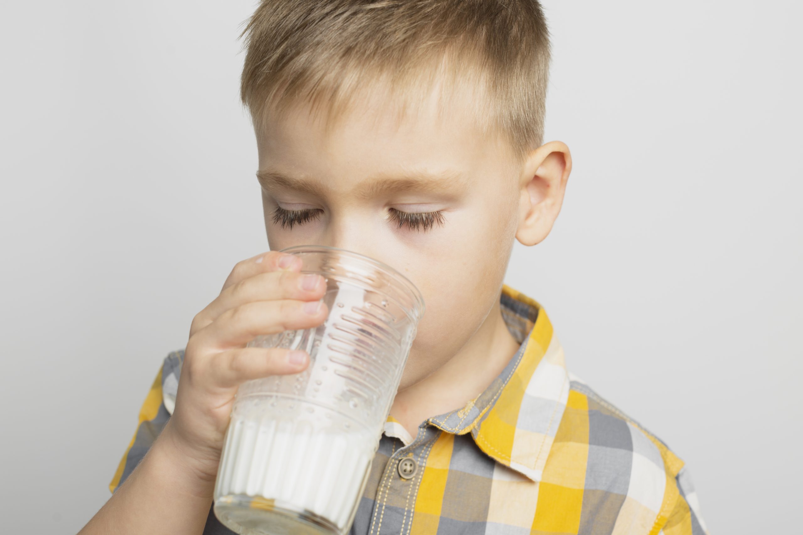 kid-drinking-milk-with-glass